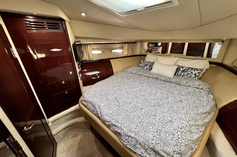 Slide: The Image of Luxurious bedroom interior of 2007 Sea Ray 58 Sedan Bridge yacht with elegant wood finishes. - 127