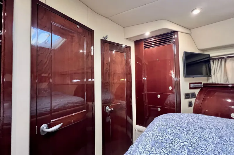 Slide: The Image of Luxurious 2007 Sea Ray 58 Sedan Bridge cabin with rich wood finishes and modern amenities. - 128