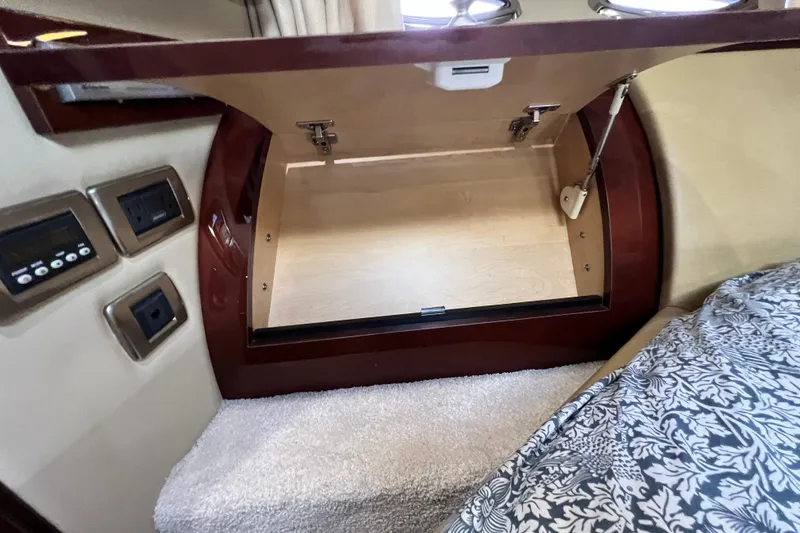 Slide: The Image of Interior storage compartment in a 2007 Sea Ray 58 Sedan Bridge yacht cabin. - 131