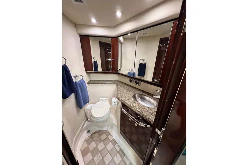 Slide: The Image of Luxurious bathroom in 2007 Sea Ray 58 Sedan Bridge yacht with granite countertop and modern fixtures. - 133