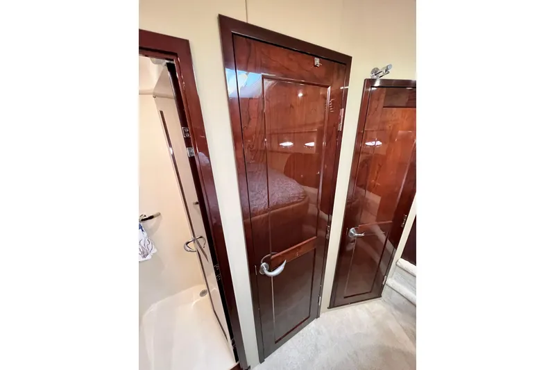 Slide: The Image of Luxurious interior of 2007 Sea Ray 58 Sedan Bridge yacht with polished wood doors. - 134