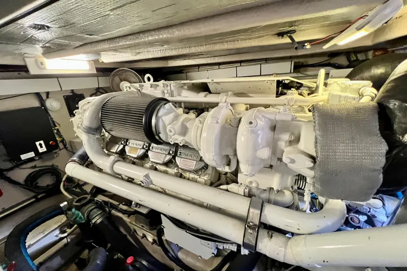 Slide: The Image of Engine room of 2007 Sea Ray 58 Sedan Bridge yacht, showcasing a powerful marine engine. - 137
