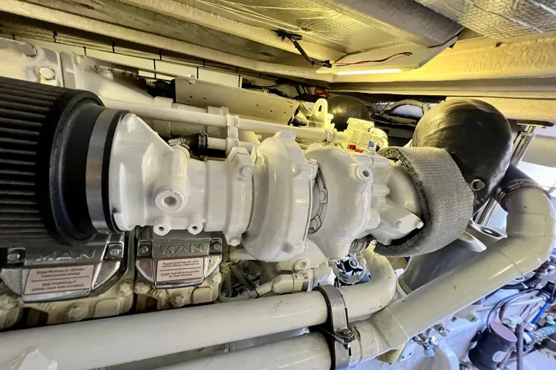 Slide: The Image of Engine compartment of a 2007 Sea Ray 58 Sedan Bridge yacht, featuring MAN components. - 138