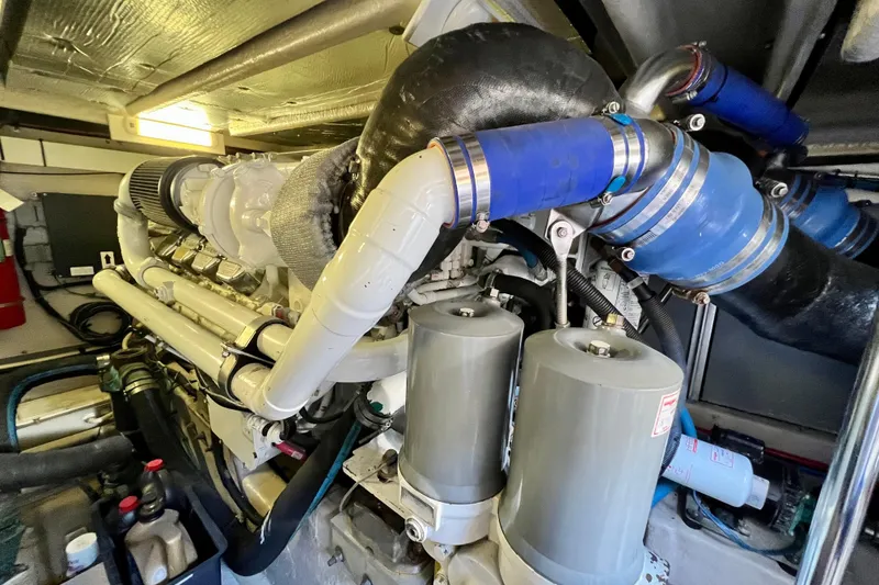 Slide: The Image of Engine room of a 2007 Sea Ray 58 Sedan Bridge yacht, showcasing complex machinery. - 139
