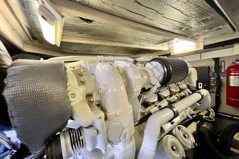 Slide: The Image of Engine room of 2007 Sea Ray 58 Sedan Bridge yacht, featuring a well-maintained engine. - 141