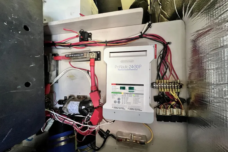 Slide: The Image of Electrical system of a 2007 Sea Ray 58 Sedan Bridge yacht, featuring ProNautic 24-30P charger. - 149