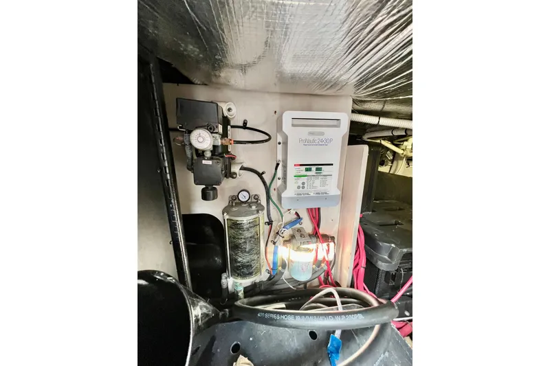 Slide: The Image of Engine room of 2007 Sea Ray 58 Sedan Bridge with electrical components and wiring. - 150