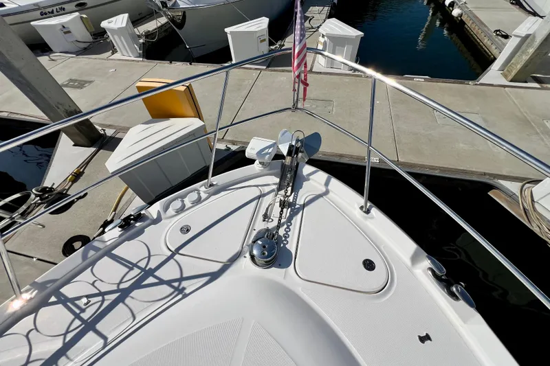 Slide: The Image of Bow view of 2007 Sea Ray 58 Sedan Bridge yacht docked at marina. - 20