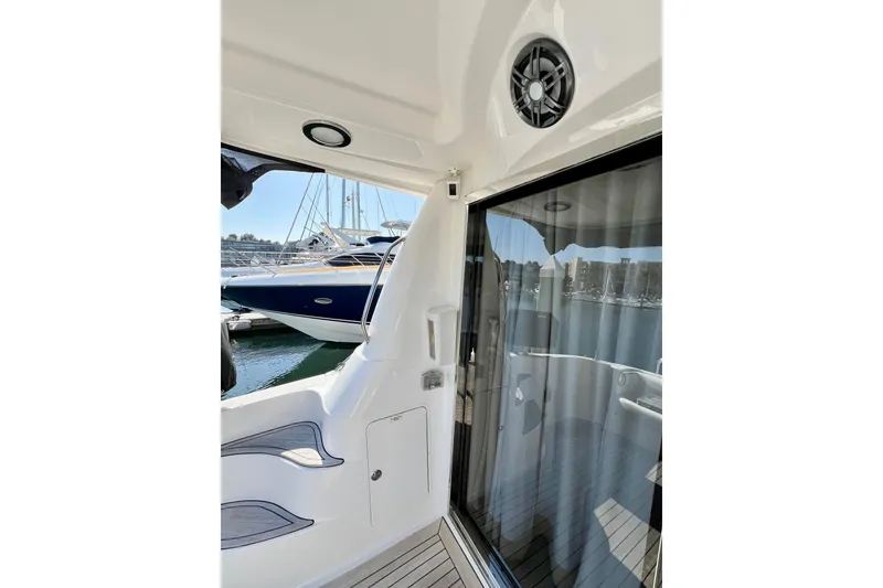 Slide: The Image of 2007 Sea Ray 58 Sedan Bridge yacht interior with marina view through glass door. - 27