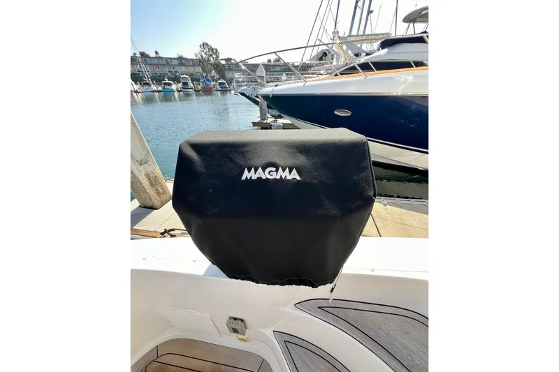 Slide: The Image of Covered Magma grill on 2007 Sea Ray 58 Sedan Bridge yacht, docked at marina. - 28