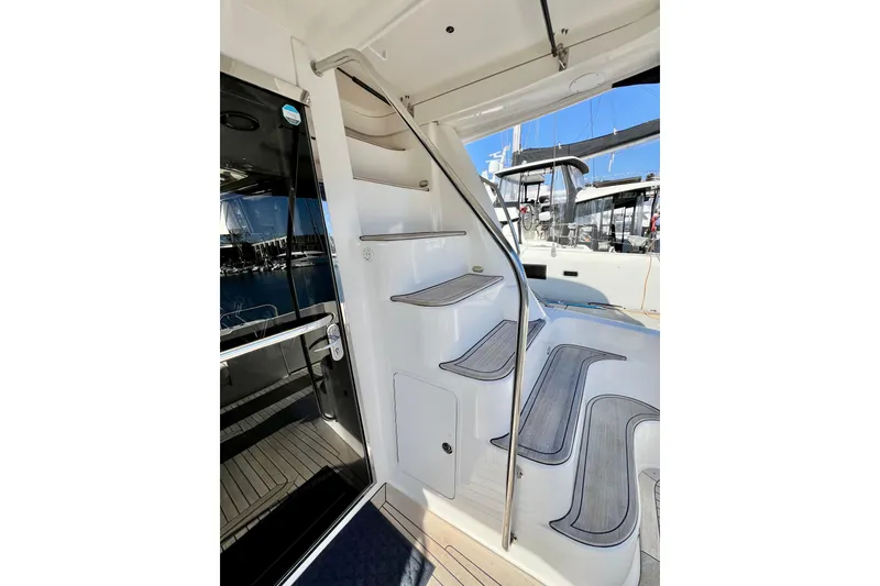Slide: The Image of Staircase on 2007 Sea Ray 58 Sedan Bridge yacht, leading to upper deck. - 36