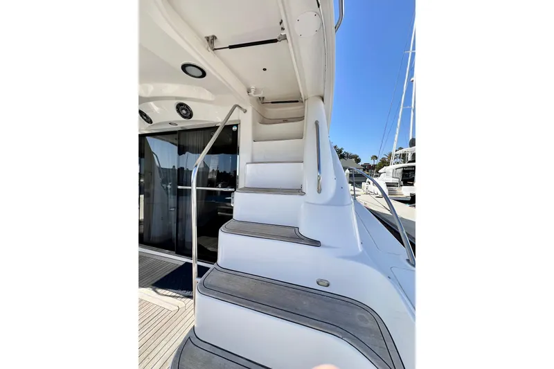 Slide: The Image of Staircase on 2007 Sea Ray 58 Sedan Bridge yacht, leading to upper deck. - 37