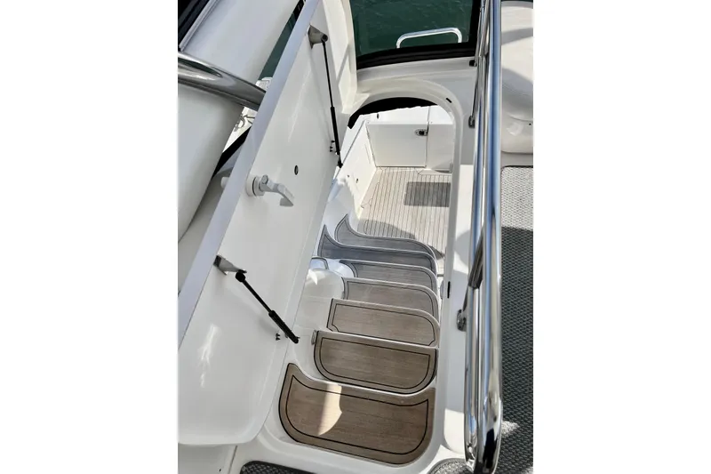 Slide: The Image of Staircase on 2007 Sea Ray 58 Sedan Bridge yacht with sleek design and wooden steps. - 40