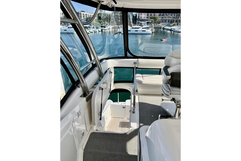 Slide: The Image of Interior view of 2007 Sea Ray 58 Sedan Bridge yacht with marina backdrop. - 42