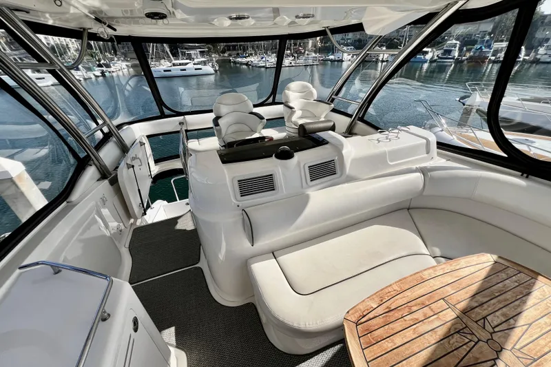Slide: The Image of Luxurious 2007 Sea Ray 58 Sedan Bridge yacht interior with plush seating and panoramic windows. - 43
