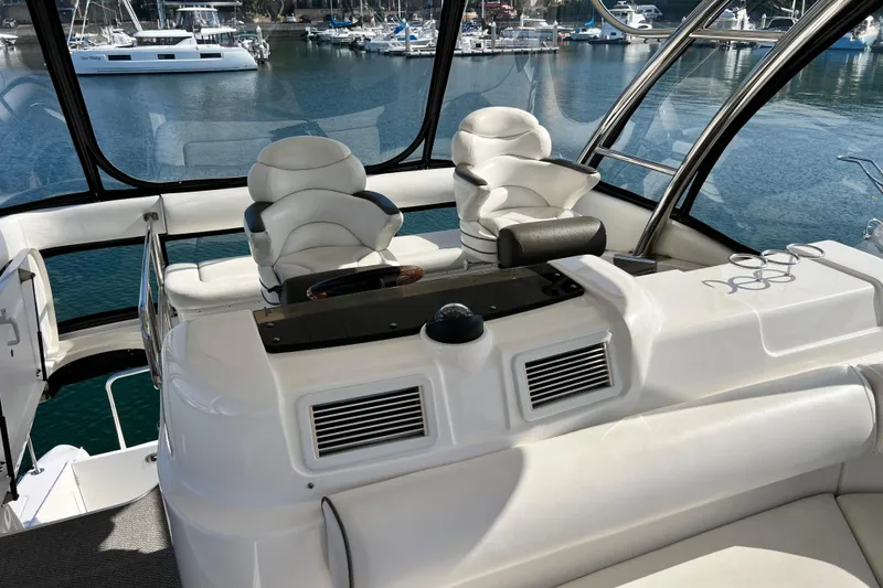 Slide: The Image of 2007 Sea Ray 58 Sedan Bridge yacht interior with helm and seating area. - 44