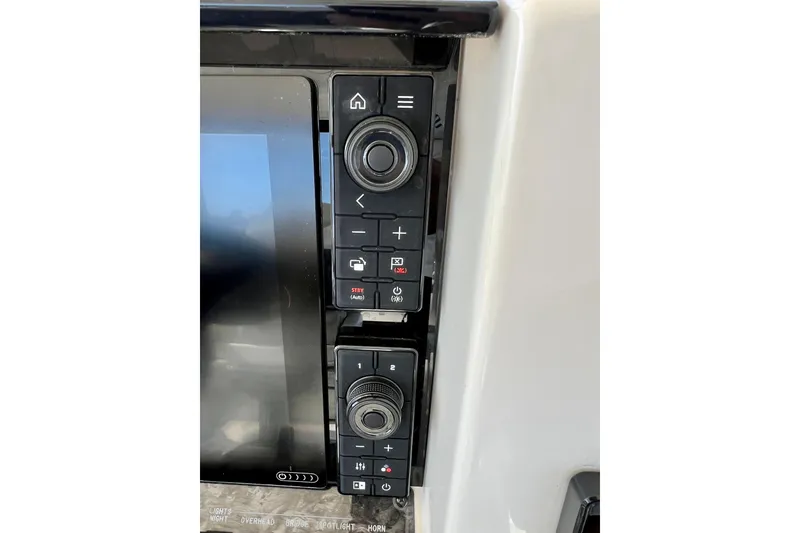 Slide: The Image of Control panel of a 2007 Sea Ray 58 Sedan Bridge yacht, featuring navigation buttons. - 48
