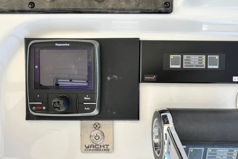 Slide: The Image of Control panel of a 2007 Sea Ray 58 Sedan Bridge yacht with Raymarine display. - 50