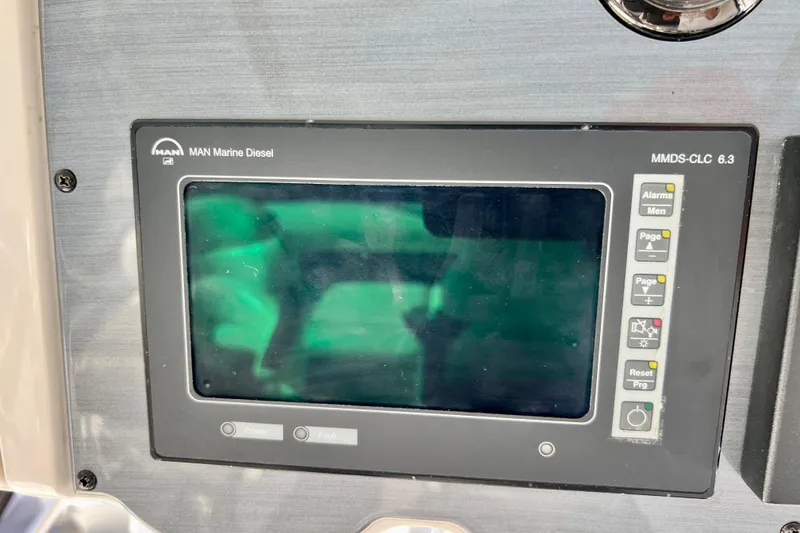 Slide: The Image of Control panel of a 2007 Sea Ray 58 Sedan Bridge with MAN Marine Diesel display. - 57