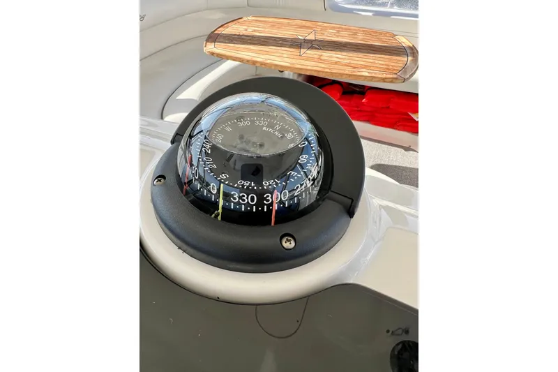 Slide: The Image of Compass on 2007 Sea Ray 58 Sedan Bridge yacht dashboard, featuring nautical navigation details. - 60