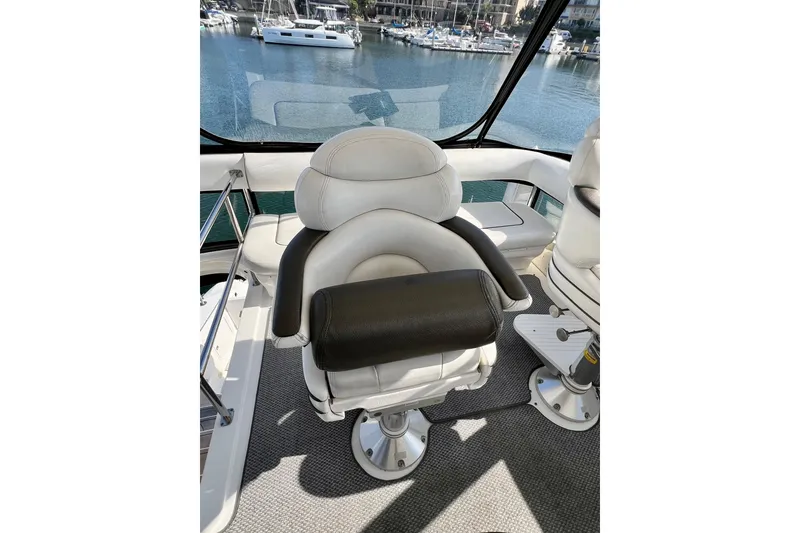 Slide: The Image of Captain's chair on 2007 Sea Ray 58 Sedan Bridge yacht, overlooking marina. - 61