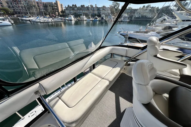 Slide: The Image of Luxurious interior of a 2007 Sea Ray 58 Sedan Bridge yacht with marina view. - 63