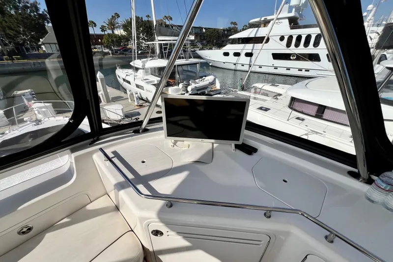Slide: The Image of 2007 Sea Ray 58 Sedan Bridge yacht interior with marina view and onboard monitor. - 68