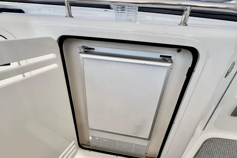 Slide: The Image of Built-in refrigerator on 2007 Sea Ray 58 Sedan Bridge yacht, featuring sleek design and stainless steel finish. - 70