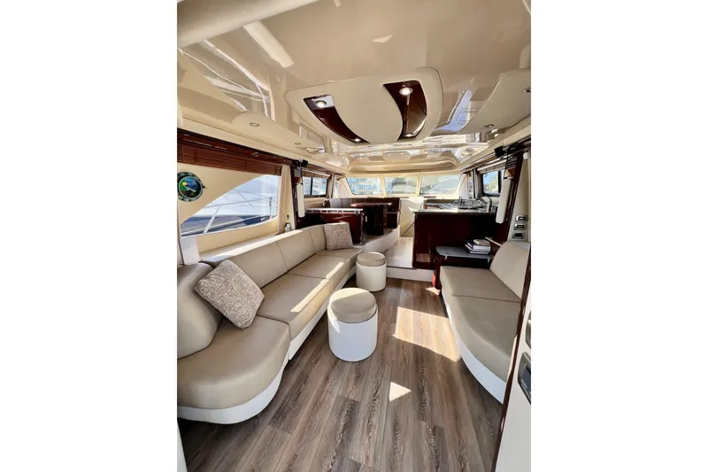 Slide: The Image of Luxurious interior of a 2007 Sea Ray 58 Sedan Bridge yacht with elegant seating and wood flooring. - 71