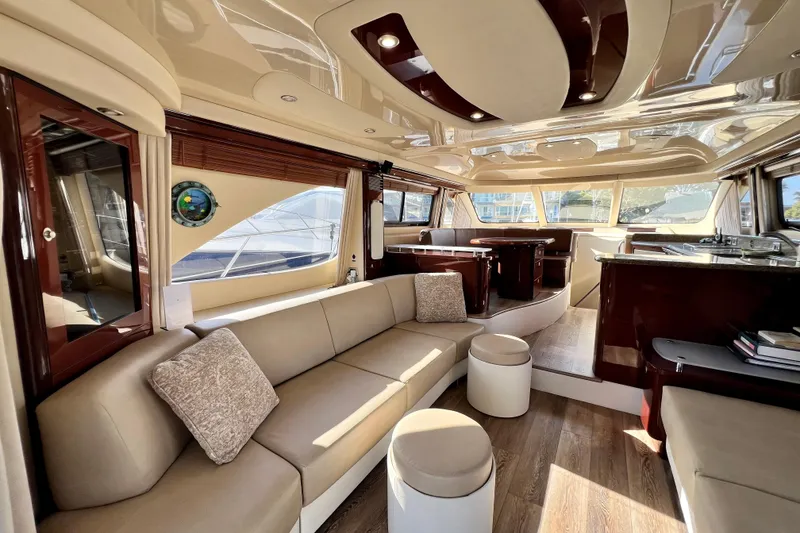 Slide: The Image of Luxurious interior of a 2007 Sea Ray 58 Sedan Bridge yacht with elegant seating and wood finishes. - 72
