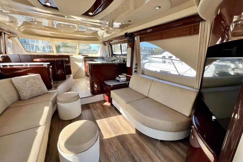 Slide: The Image of Luxurious interior of a 2007 Sea Ray 58 Sedan Bridge yacht with elegant seating and wood finishes. - 74