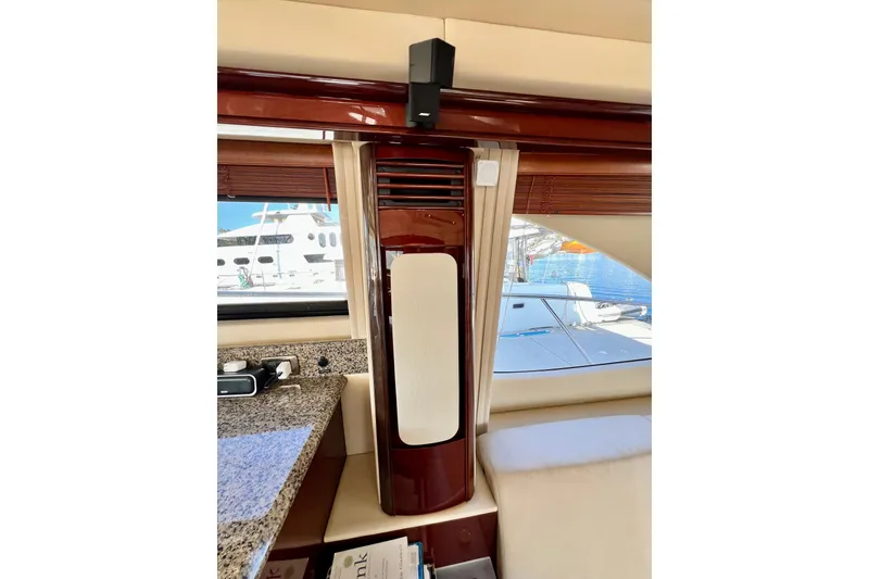 Slide: The Image of Interior view of 2007 Sea Ray 58 Sedan Bridge yacht with elegant wood finish. - 76