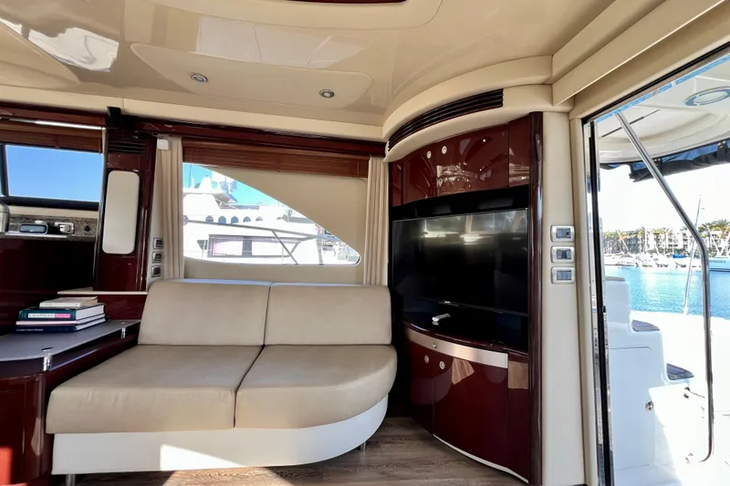 Slide: The Image of Luxurious interior of 2007 Sea Ray 58 Sedan Bridge yacht with sofa and TV. - 78