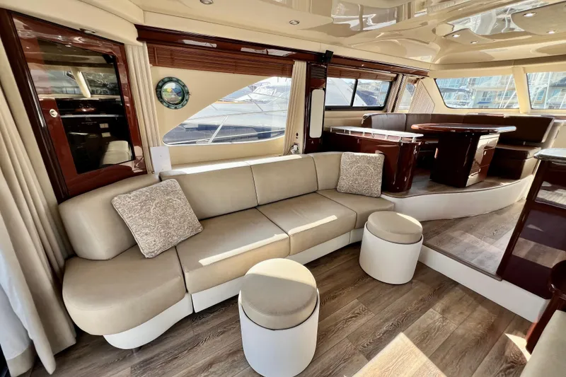 Slide: The Image of Luxurious interior of a 2007 Sea Ray 58 Sedan Bridge yacht with elegant seating and wood accents. - 82