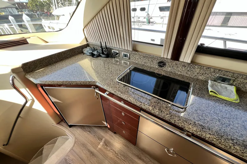 Slide: The Image of Luxurious 2007 Sea Ray 58 Sedan Bridge yacht interior with modern kitchen amenities. - 87