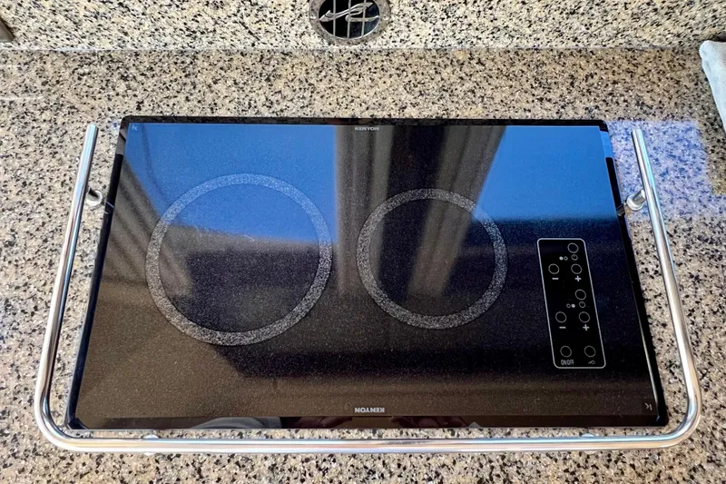 Slide: The Image of Built-in cooktop on 2007 Sea Ray 58 Sedan Bridge yacht, granite countertop. - 88