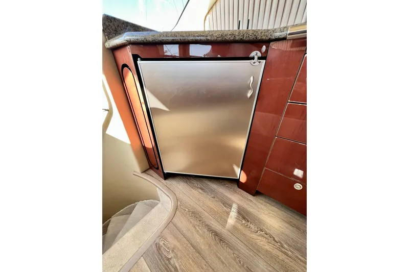 Slide: The Image of Stainless steel refrigerator in 2007 Sea Ray 58 Sedan Bridge yacht interior. - 92