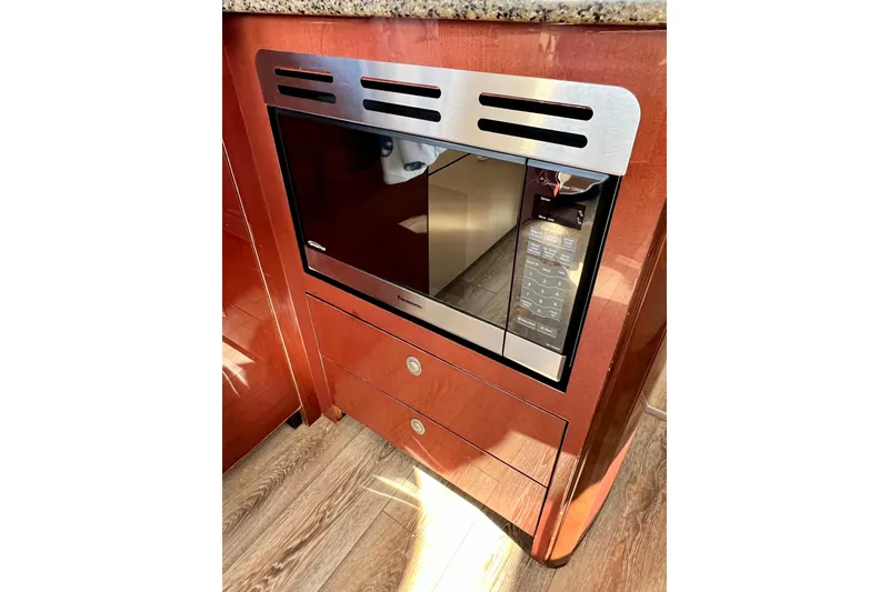 Slide: The Image of Built-in microwave in 2007 Sea Ray 58 Sedan Bridge yacht kitchen. - 96