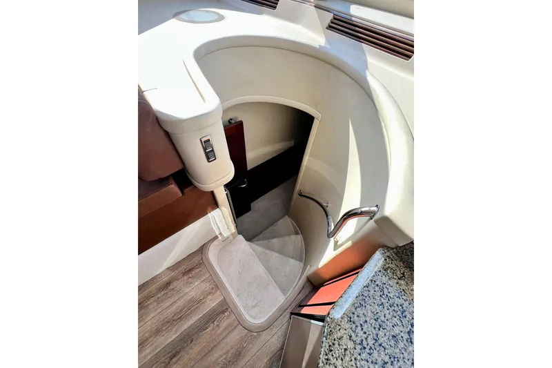 Slide: The Image of Interior staircase of 2007 Sea Ray 58 Sedan Bridge yacht, featuring elegant design and wood flooring. - 99