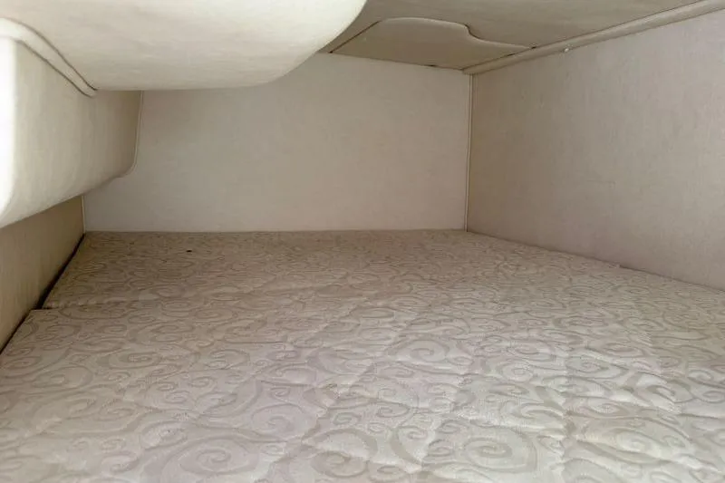 Slide: The Image of Interior cabin of 2005 Sea Ray Sundancer 280 with quilted bedding. - 13