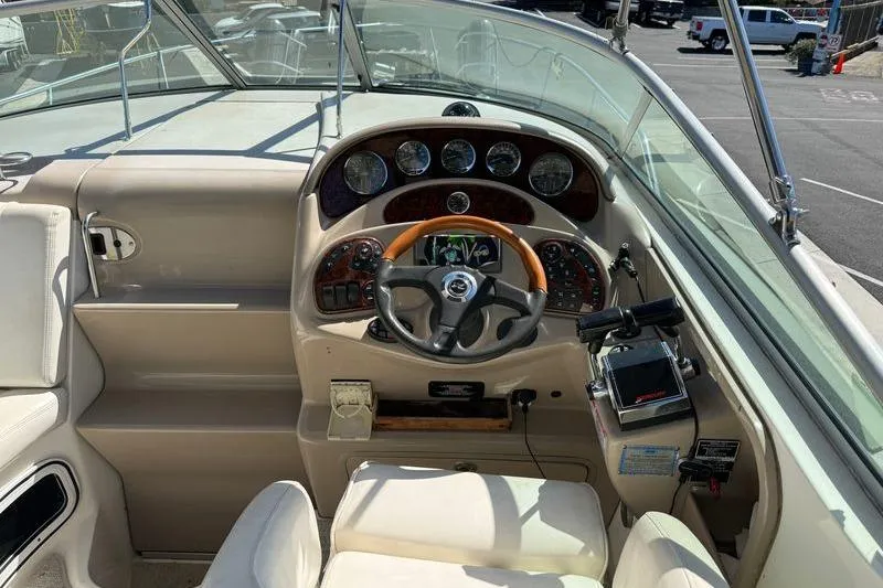 Slide: The Image of Cockpit of 2005 Sea Ray Sundancer 280 with steering wheel and control panel. - 6