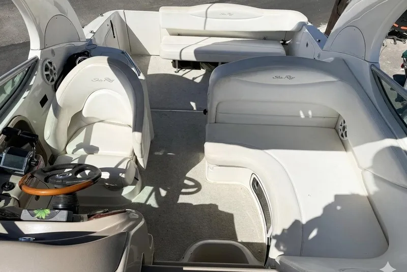 Slide: The Image of 2005 Sea Ray Sundancer 280 interior with white seating and helm, showcasing luxury design. - 7