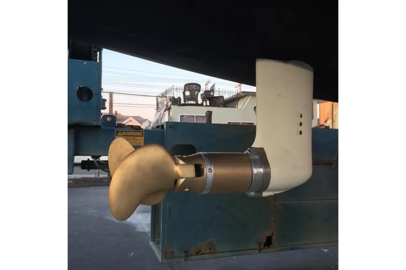 Slide: The Image of Propeller and rudder of a 1986 Farr 1020 sailboat in a shipyard. - 10