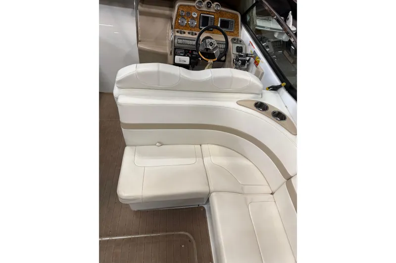 Slide: The Image of 2009 Formula 310 Sun Sport boat interior with white seating and control panel. - 10