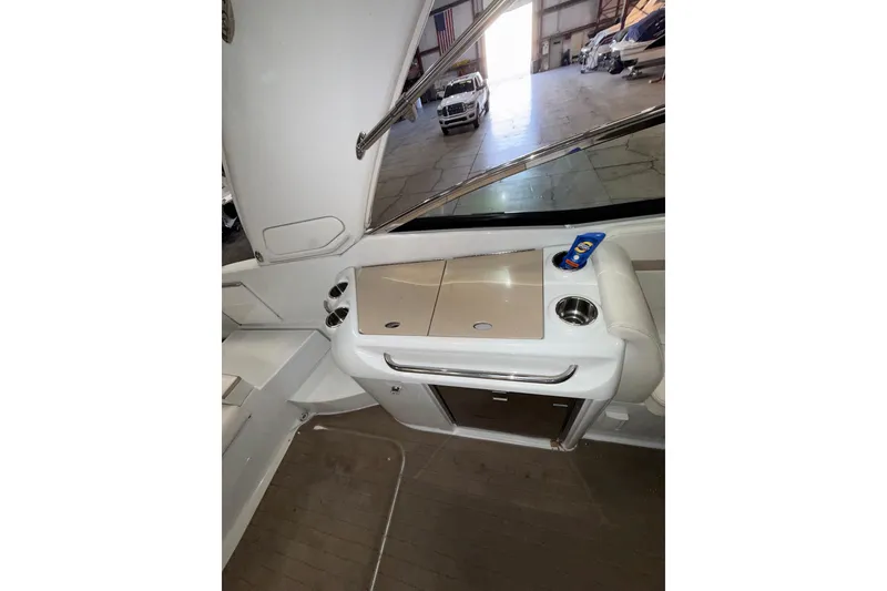 Slide: The Image of Interior view of a 2009 Formula 310 Sun Sport boat with a compact kitchenette. - 11