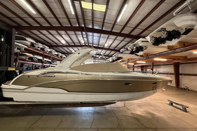 Slide: The Image of 2009 Formula 310 Sun Sport boat in indoor storage facility. - 2