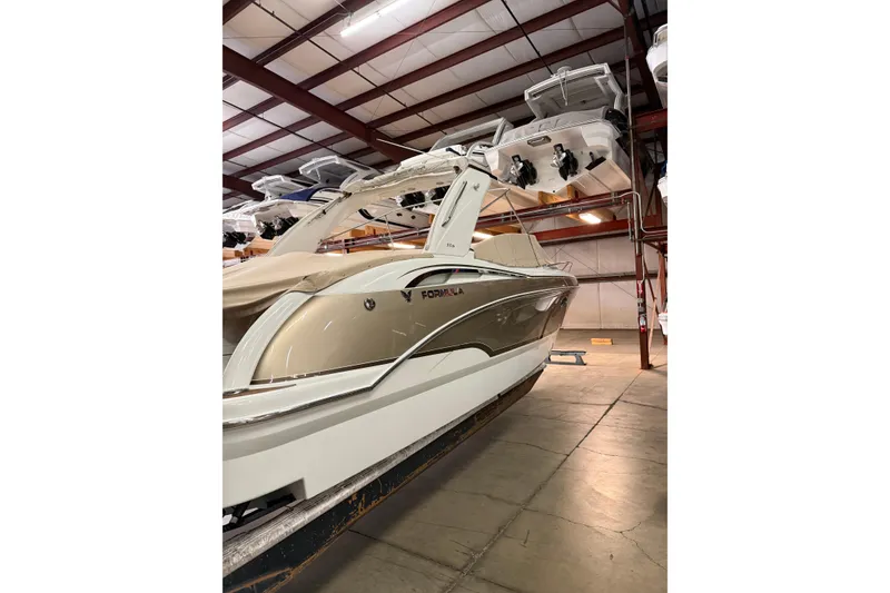 Slide: The Image of 2009 Formula 310 Sun Sport boat in indoor storage facility. - 3
