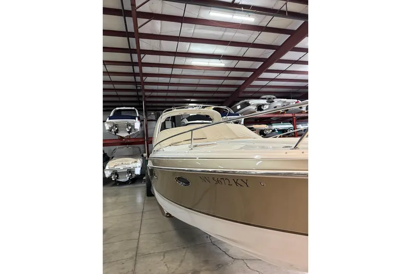 Slide: The Image of 2009 Formula 310 Sun Sport boat in indoor storage facility. - 4