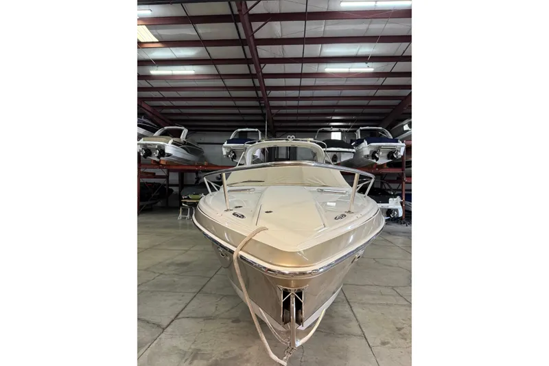 Slide: The Image of 2009 Formula 310 Sun Sport boat in indoor storage facility. - 5