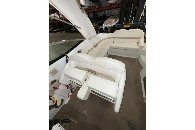 Slide: The Image of 2009 Formula 310 Sun Sport boat interior with white seating and spacious layout. - 7